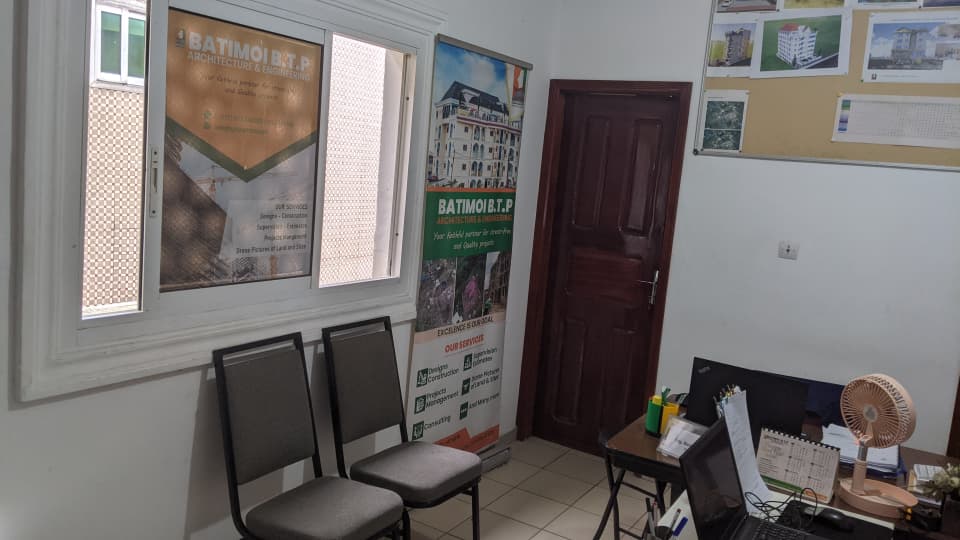 BATIMOI BTP team working on architectural drawings at the Buea office